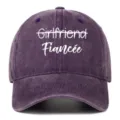 Front view of a purple washed cotton baseball cap featuring white Fiancee embroidery - Adjustable / Purple (Fiancee)