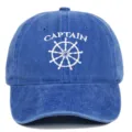 Detailed view of a blue washed cotton baseball cap with Captain embroidery design - Adjustable / Sapphire Blue
