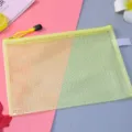 Close-up of yellow waterproof mesh document bag with secure yellow zipper closure - A5 / Yellow