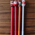 Set of four creative Christmas themed gel pens with Santa Claus and snowman toppers - Mascot Christmas Pen / 0.7mm