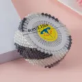 Close-up of 40 pearl-headed pins in a plastic wheel, ideal for sewing and crafting details. - 40 Pieces/Pack / Black and White