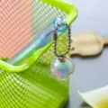 Cute aesthetic gel pen featuring a translucent iridescent glitter ball pendant charm for students - 0.5mm / Blue