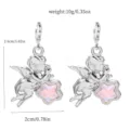 Angel star earrings detail view showcasing pink crystal and alloy craftsmanship. - 10