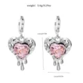 Detailed view of silver-toned pink crystal heart earrings with dimension and weight specs. - 12