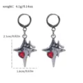 Detailed close-up of dark punk gothic style silver star earrings with red heart crystal. - Cross Star Rhinestone Style