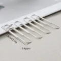Large silver metal paperclips for office and school document organization, durable and sturdy. - 78mm Silver Color in Bulk