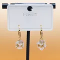 Exquisite gold hoop earrings featuring clustered white flower pendants with sparkling rhinestones. - C-599 Gold