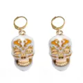 Gold-tone skull leverback earrings with white enamel finish, gothic style Halloween jewelry. - Skull Earrings (C-615)
