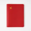 Red leather passport cover with gold airplane motif, travel document holder organizer. - Bright Red