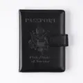 Black PU leather RFID blocking passport holder with snap closure and embossed USA design. - Black