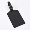Black PU leather luggage tag featuring embossed world map design for travel identification - Black