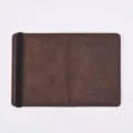 Brown PU leather passport holder detail, featuring elastic strap and debossed travel text. - Coffee