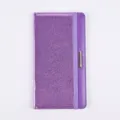 Purple glitter PU leather passport holder detail close-up, elastic band and metal accent. - Purple