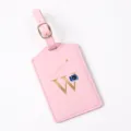 Pink leather luggage tag with gold letter W and camera motif for travel bags and suitcases. - Letter W / Pink