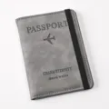 Grey PU leather passport wallet with elastic band detail view showing travel branding - Passport Gray