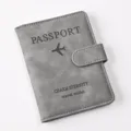 Close-up detail of grey PU leather passport wallet featuring a secure magnetic snap closure. - Passport Cover / Gray
