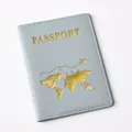 Closeup of grey PU leather passport cover featuring elegant gold foil world map and text. - 14.2*10.8cm / Gray