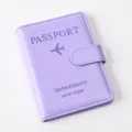 Detail view of the purple PU leather passport wallet with magnetic buckle and embossing. - Passport Cover / Light Purple