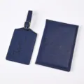 Dark blue PU leather passport holder and luggage tag set with embossed adventure travel text. - Dark Blue