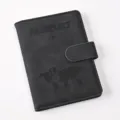 Close-up of black PU leather passport holder with magnetic snap, map and passport emboss. - Passport Cover / Black