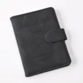 Black PU leather passport cover wallet with magnetic snap closure and embossed travel details. - Passport Cover / Black