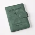 Close-up detail of green PU leather passport holder with magnetic snap and textured finish. - Passport Cover / Green