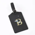 Black leather luggage tag with gold letter B detail, ideal for travel bags and suitcases. - Letter B / Black