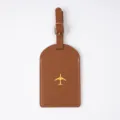 Brown PU leather luggage tag with gold airplane icon and metal buckle strap variant. - Luggage Tag / Brown