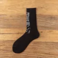 Black cotton crew socks featuring a stylish paisley pattern, comfortable ribbed cuff design. - 36-44 / Double Needle Paisley - Black
