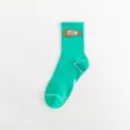 Green cotton crew socks featuring a stylish leather label and breathable knit for streetwear. - 36-44 / Green