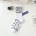 Trendy white crew socks featuring classic black paisley bandana pattern for stylish casual wear. - 36-43 / 2022 Paisley Pattern White Socks