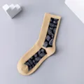 Trendy casual crew socks featuring a stylish black vertical paisley panel on khaki cotton. - 36-43 / Vertical Striped Paisley Socks in Beige