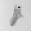 Korean style nep mid-tube casual socks with color-blocked design and cute fabric label for use. - 36-44 / Beige and Light Grey Patchwork