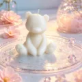 Close-up view of a cute sitting bear scented candle, ideal for cozy room decor and gifts. - White