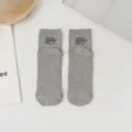Minimalist grey ribbed cotton socks for spring summer, featuring stylish cuff text and cozy wear. - One Size / Gray