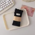 Black ribbed ruffle mid-calf socks with cloth label and paper band packaging for women. - 36-42 / Dark Gray