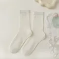Women cream white mid-calf socks with vertical stripes, breathable mesh knit style. - One Size / Milk White
