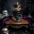 Detailed view of a gothic skull scented candle with top hat design, perfect for Halloween decor. - Black