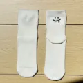 White cotton socks featuring cute embroidered melting smile design, comfortable casual streetwear. - One Size / White