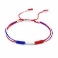 Handmade red white and blue braided friendship bracelet featuring metallic bead accents - United kingdom france