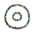 Handgemachtes elastisches Perlenarmband und Ring-Set aus afrikanischem Türkis mit Goldperle - Armband Und Ringe