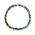 Elastisches Armband aus echtem afrikanischem Türkis mit einer goldenen Akzentperle - Armband