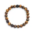 Pulsera artesanal de cuentas de piedra ojo de tigre con una cuenta negra mate central - Pulsera