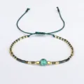 Handmade Bohemian beaded bracelet featuring semi-precious stone and adjustable cord. - Dark Green