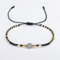 Hand-woven Miyuki seed bead bracelet with grey semi-precious stone and gold accents - Black
