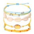 Handgefertigtes Bohème-Armbandset mit Kaurischnecken und gelbem Edelstein - Muschel-Stil