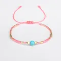 Handmade Bohemian Miyuki seed bead friendship bracelet with blue faceted stone accent. - Pink