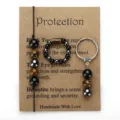 Beaded jewelry set with Tiger's Eye and Hematite bracelet, ring, and keychain on card. - 3 Piece Set (With Card)