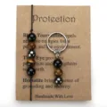 Handmade Tiger Eye and Hematite beaded bracelet and keychain set on a protection card - Bracelet And Keychain Set (With Card)