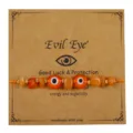 Handgefertigtes orangefarbenes Evil Eye Armband mit Natursteinen und Kupferperlen - Orange